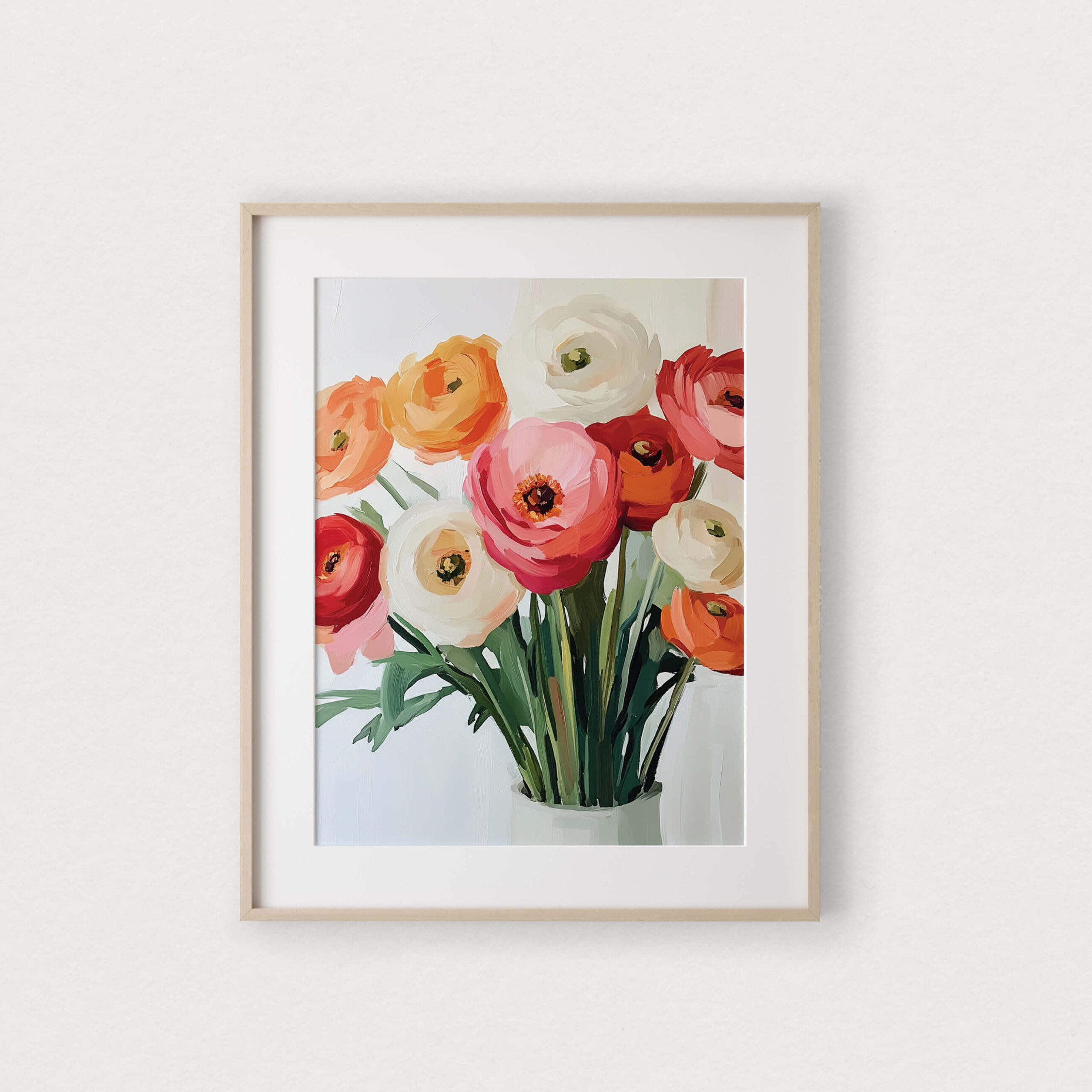 Affiche murale Renoncules illustrant un bouquet coloré de renoncules dans un vase blanc, présentée dans un cadre en bois naturel.